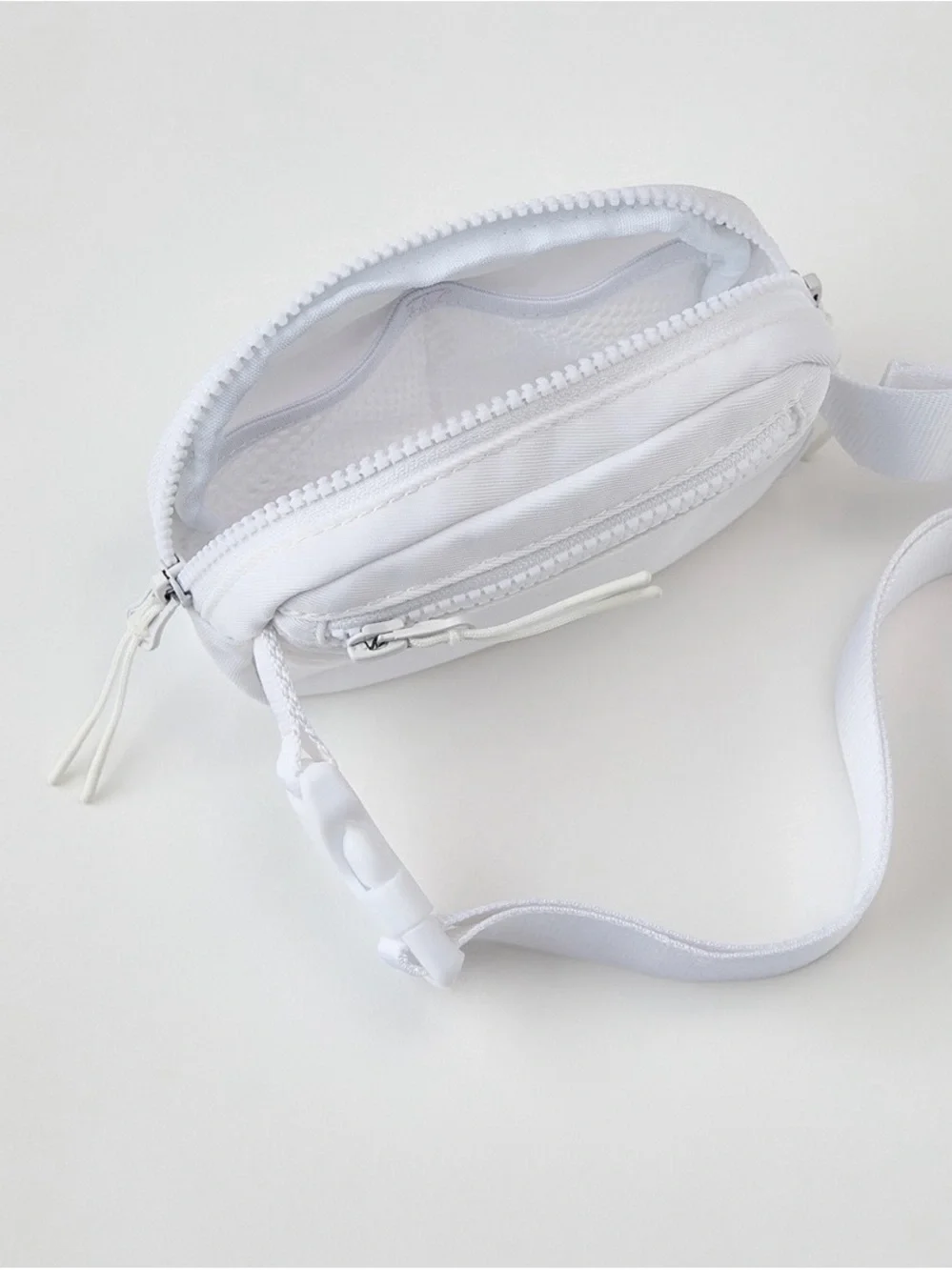 Fabletics mini belt bag in classic white